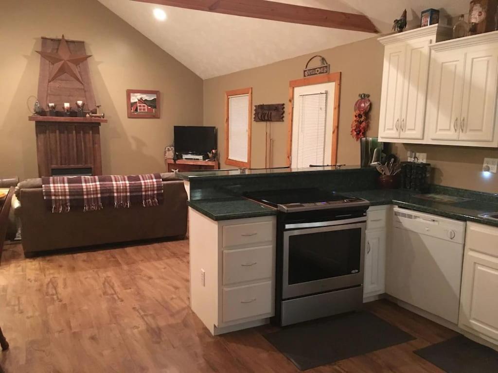 Gas Fireplace, Firepit, And Cedar Adirondack Chair Spencer Ngoại thất bức ảnh